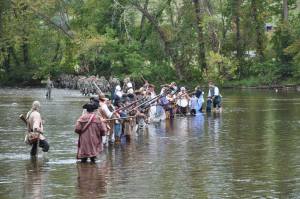 The militia, members of the OVTA and the Tennessee National Guard crossing the river